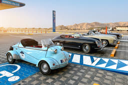 Messerschmitt in the company of a 300SL and a Porsche Speedster.